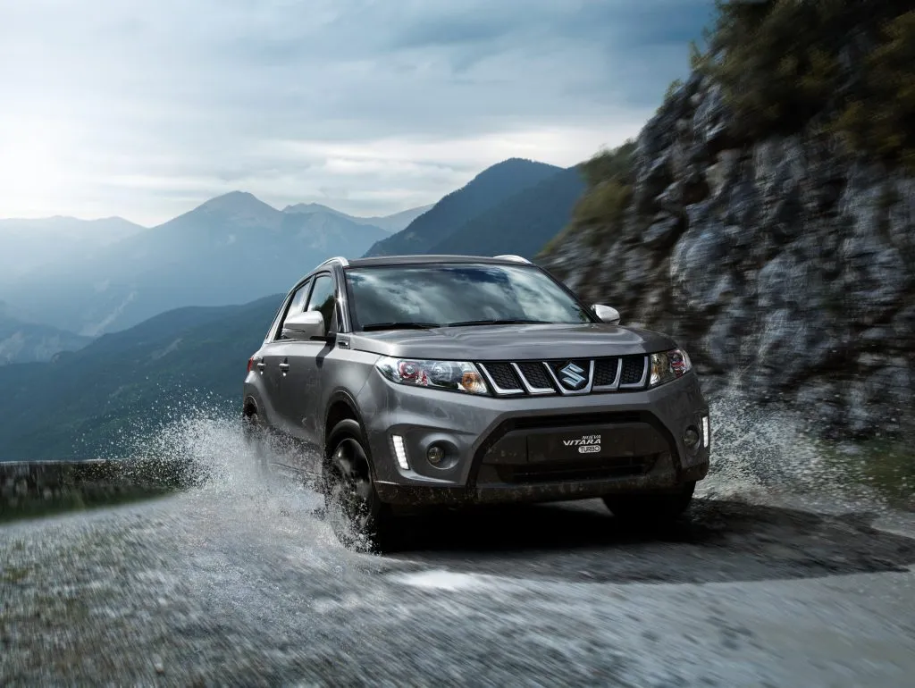 Suzuki Vitara driving through a mountain road